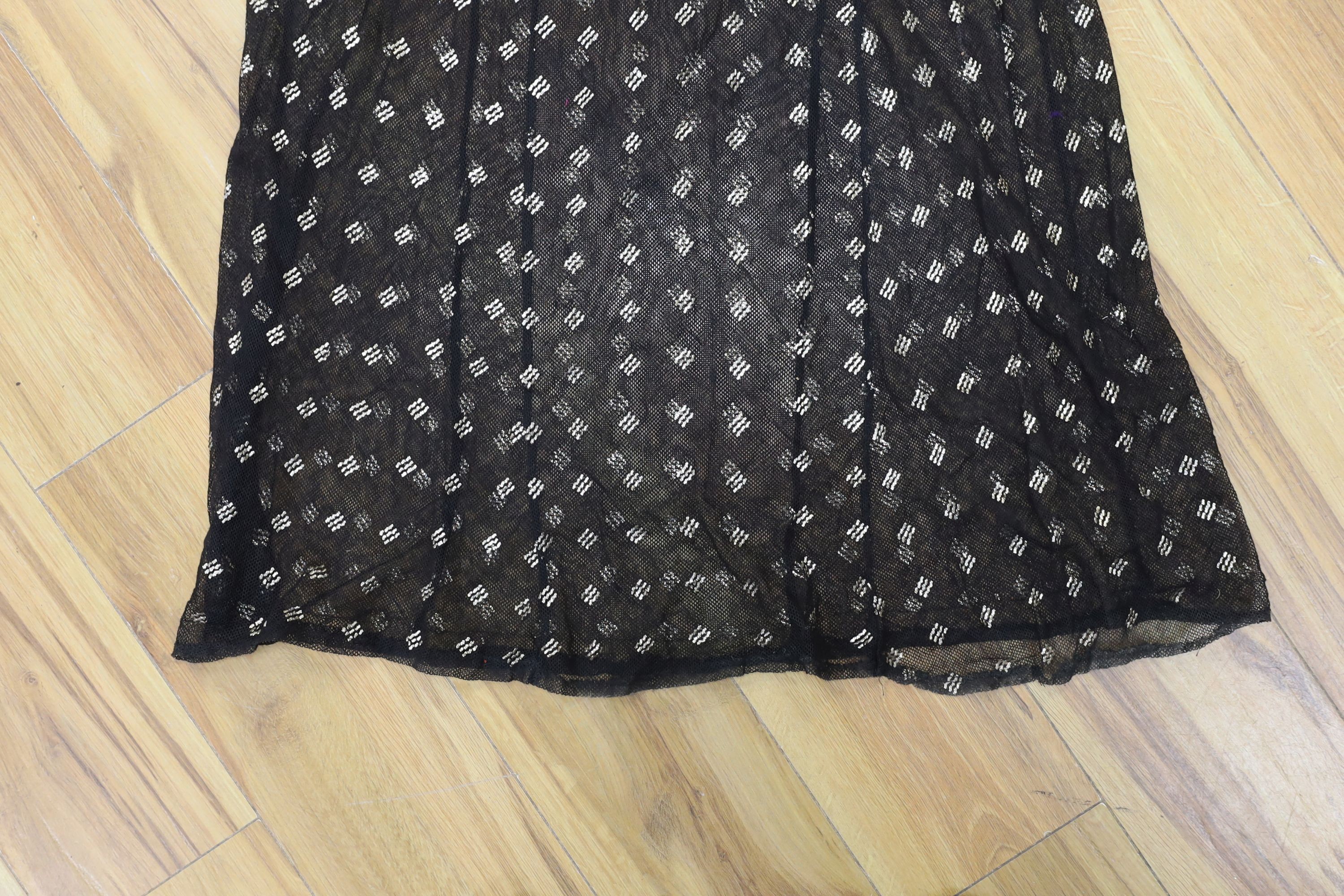 A dress made from a metal and black net Egyptian shawl; a similar shawl and a piece of shawl